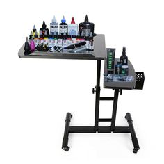 a black table with bottles and pens on it