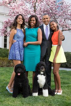 the obama family poses with their two poodles