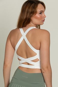 Our Whiteout Criss Cross Back Yoga Tank is our newest athletic tank and it is so flattering! It has a U-shaped front that offers coverage and a cute criss-cross style back. It features our ultra smooth, sweat-wicking material that you can wear when active or just out for the day! It is complete with built-in padding that can be removed if needed. Stretch Sports Bra With Mesh Cross Back, Crisscross Stretch Sports Bra For Yoga, Stretch Crisscross Sports Bra For Pilates, Crisscross Stretch Sports Bra For Pilates, Crisscross Sports Bra For Pilates, Stretch Crisscross Activewear For Workout, Athleisure Activewear With Crisscross Straps And 4-way Stretch, Versatile Activewear With Built-in Bra And Cross Back, Crisscross Light Support Sports Bra For Workout