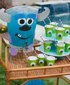 an outdoor pool party with monster cups and drinks