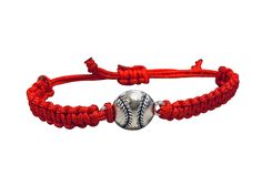 a baseball bracelet with an orange cord and silver bead on the clasp, is shown