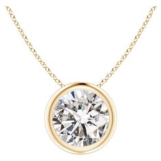 This classic solitaire diamond pendant's beautiful design makes the center stone appear like it's floating on the chain. The sparkling diamond is secured in a bezel setting. Crafted in 14k yellow gold, this round diamond pendant makes an elegant style statement. Available in different carat weight. Diamond is the Birthstone for April and traditional gift for 10th wedding anniversary. Free Certificate of Authenticity. All items are packaged with care in appealing boxes with plush interiors. Round Diamond Pendant, Solitaire Diamond Pendant, Solitaire Pendant Necklace, Sparkling Diamond, Bezel Set Diamond, Solitaire Diamond, Jewelry Show, Modern Necklaces, Solitaire Pendant