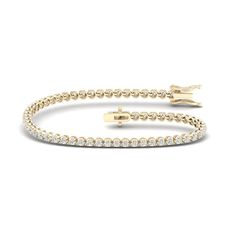 A simple classic, this lab-created diamond tennis bracelet is an ace. Wear it alone or stack your wrist! This jewelry is made with lab-created diamonds. Lab-created diamonds have the same optical, chemical, and physical properties as diamonds created by the earth. Made in responsibly sourced 10K solid yellow gold for everyday wear. Set with 2 ct. t.w. lab-created diamonds. Length: 7.25 in. Luxury Lab-grown Diamond Classic Tennis Bracelet, Everyday Luxury Gold-plated Diamond Jubilee Bracelet, Yellow Gold Diamond-cut Tennis Bracelet Gift, Yellow Gold Tennis Bracelet - Fine Jewelry Gift, 14k Gold Diamond Bracelet, Tarnish Resistant, Tennis Bracelet Diamond, Lab Created Diamonds, Kids Jewelry, Tennis Bracelet