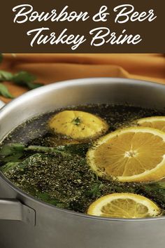 a pot filled with broth and lemon slices