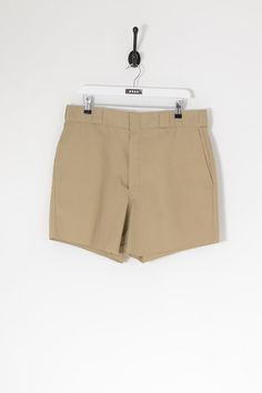 "Gender:Womens  Vintage Dickies cut off chino shorts in beige with zip fly. Waist measures 36\". Made from cotton blend  Condition:Excellent    Measurements:     Waist Measurement: 36\"   Inside Leg: 5\"" Khaki Cotton Workwear Shorts, Classic Beige Cotton Shorts, Fitted Cotton Bermuda Shorts In Beige, Fitted Beige Cotton Bermuda Shorts, Classic Beige Bermuda Shorts, Classic Beige Shorts With Built-in Shorts, Beige Cotton Shorts With Short Inseam, Classic Beige High-waisted Shorts, Denim Scraps