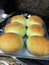 six rolls sitting on top of a metal pan