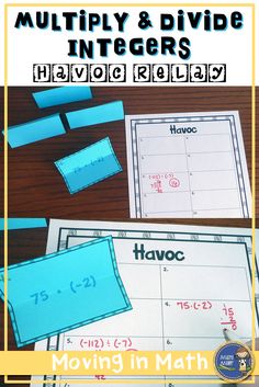 a table with two pieces of paper on it and the words, multiply and divide int