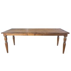 an old wooden table with two drawers on one side and legs at the bottom, against a white background