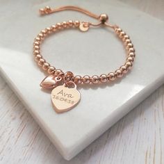 "Wear your heart on your sleeve quite literally with our beautiful slider bracelets! This beautiful rose gold bracelet combines a rose gold heart charm, perfect for engraving a name or special date, alongside a dinky rose gold puffed heart charm. The rose gold vermeil heart charm measures 12mm across the front of the heart and sits centrally on a rose gold vermeil ball slider bracelet crafted with dainty 4mm rose gold beads. The dinky rose gold vermeil heart charm measures 10x8mm and has been de Adjustable Rose Gold Jewelry With Heart Charm, Rose Gold Heart Charm Bracelet For Friendship, Adjustable Rose Gold Name Bracelet For Friendship, Rose Gold Heart Bracelet For Friendship, Rose Gold Bracelet For Mother's Day Best Friend Gift, Rose Gold Heart Charm Bracelets For Anniversary, Rose Gold Bracelet With Heart Charm For Anniversary, Rose Gold Bracelets With Heart Charm For Anniversary, Adjustable Rose Gold Heart Bracelet For Valentine's Day