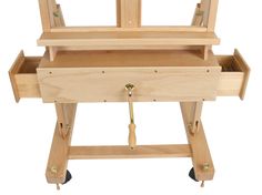 a wooden workbench with three drawers on wheels