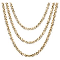 Designer: custom design Material: 14K yellow gold Diamond: 277 round brilliant cut = 54.10cttw Color: G / H Clarity: VS1-2 Dimensions: necklace measures 22-inches in length Weight: 119.72 grams Luxury Yellow Gold Diamond Cut Tennis Necklace, Diamond Tennis Necklace, Diamond Necklaces, Gold Diamond Necklace, Tennis Necklace, Brown Diamond, G H, Yellow Diamond, Round Brilliant