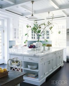 an instagram photo of a kitchen with white cabinets and wood floors, along with the caption that reads'i hour ago lavender hill interiors '