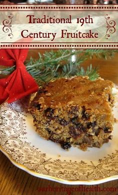 a plate with a piece of fruit cake on it and a red bow around the edge