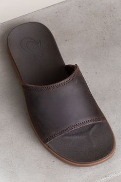 Men's OluKai Alania Slide Leather Sandals | Overland Men’s Slides Outfit, Brown Leather Sport Sandals For Vacation, Brown Leather Beach Sport Sandals, Leather Slide Flip Flops For Outdoor, Leather Slip-on Sport Sandals For Beach, Casual Leather Sport Sandals With Closed Toe, Casual Closed Toe Leather Sport Sandals, Casual Leather Closed Toe Sport Sandals, Brown Rubber Sole Slip-on Sport Sandals