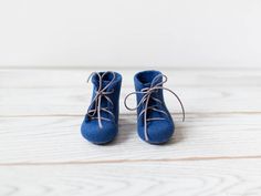 Baby shoes in beautiful deep blue - perfect baby's first gift, nice idea for baby shower gift. Made without any seams from eco friendly 100% Merino wool using just water and olive oil soap. Felted baby ankle boots are very suitable for babies as they are made from pure merino wool that lets the small feet breath. Such booties are perfect for any season: they will keep the feet warm in winter and cool in summertime due to the natural properties of wool. Color: royal blue with grey laces. SIZES: - Handmade Blue Booties For Gift, Handmade Blue Booties As A Gift, Handmade Blue Booties As Gift, Handmade Round Toe Booties As Gift, Handmade Round Toe Booties Gift, Felt Booties, Blue Ankle Boots, Christmas Slippers, Felt Baby