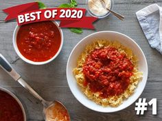 two bowls of pasta and sauce on a table with the words best of 2020 over it