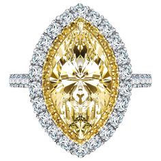 This Spectacular Yellow (Color U-V) 3.70 Carat VS1 Marquise Diamond which is set in the center with 0.15 Carat of Round Brilliant cut Fancy Intense Yellow Diamonds on the perimeter an additional 1.10 Carat of Round White Brilliant Diamonds on the Outer Halo flowing down the side of the shank giving this Double Halo Diamond Engagement Ring an exceptional and unique look in its platinum setting. This Ring has been designed and hand Made In Britain from start to finish, ring size UK - M 1/2, US - 6 Double Halo Diamond Engagement Ring, Fancy Diamond Ring, Canary Diamond, Double Halo Engagement Ring, Double Halo Engagement, Marquise Diamond Ring, Fancy Yellow Diamond, Modern Engagement Rings, Double Halo