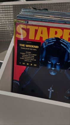 a stack of records sitting on top of a table