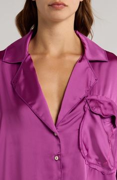 Buttery-soft satin refines this drapey long-sleeve pajama shirt in an oversized fit that lets you sink into its luxurious comfort. 30 1/2" front length; 32" back length (size Medium) Front button closure Notched collar Chest patch pocket Long sleeves 100% polyester Hand wash, line dry Imported Purple Long Sleeve Pajama Party Sets, Playful Long Sleeve Super Soft Sleepwear, Purple Satin Pajamas, Fun Multicolor Long Sleeve Sleepwear, Pink Silk Long Sleeve Sleepwear, Satin Pajama, Satin Pajamas, Pajama Shirt, Notched Collar