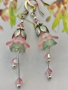 Flower Earrings . Frosted Pink And Green lucite. Genuine Swarovski Pink AB Crystals. Dangles about 2.5" in length and is .75 " in width. Silver Plated Ear wires and Components. Unique and Beautiful Earrings of both Great Quality and Design. Lucite Flower Earrings, Polymer Clay Flower Jewelry, Pretty Jewelry Necklaces, Lucite Jewelry, Beading Jewelery, Fairy Jewelry, Clay Flower, Earrings Inspiration, Homemade Jewelry