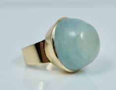 A fabulous ring.  This statement ring was crafted in Helsinki Finland in 1967 and features a MASSIVE 37.06 carat cabochon cut aquamarine set into solid 14k yellow gold. The ring is clearly hallmarked "RAP 585 O7" along with the country mark for Finland and city mark for Helsinki. The aquamarine measures 20.52 mm x 19.13 mm x 13 mm and weighs approximately 37.06 carats. The entire ring weighs 13.7 grams, and is a size 6.5 on a ring mandrel, though it could fit up to a size 6.75. The aquamarine do Ring Mandrel, Modernist Ring, Helsinki Finland, Helsinki, Statement Ring, Rings Statement, Jewelry Ideas, Finland, Aquamarine