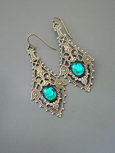 "Vintage Jewelry - Vintage Earrings - Art Nouveau Earrings - Emerald Green Earrings - Filigree Earrings - Brass Earrings - handmade jewelry These are such exquisite earrings! Gorgeous long vintage brass intricate lacy earrings embellished with an emerald green glass stone. If you would like these for your bridesmaids just let me know. Chloe says, \"Wear them and feel fabulous!\" They measure a stunning 2 1/2\" long\" from the top of the ear wire. Thanks for visiting Chloe's" Ornate Handmade Chandelier Earrings For Party, Handmade Ornate Chandelier Earrings For Parties, Victorian Filigree Chandelier Earrings As Gift, Artistic Brass Earrings Nickel Free, Silver Brass Chandelier Earrings For Gift, Unique Drop Chandelier Earrings, Handmade Vintage Drop Chandelier Earrings, Handmade Vintage Chandelier Drop Earrings, Handmade Vintage Sterling Silver Chandelier Earrings