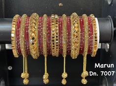 *Bollywood Style Bridal Bangle set- Australian business *Traditional Bangle set with heavy  Centre Kada and stone beaded Bangle on sides and plain velvet finish bangles. These bangles are ideal for the bride. *If you are looking to accessorize your saree and Lehenga in a traditional way, then look no Further. This  beautiful design is sure to grace any Indian outfit. Silver Indian bangles with tiny crystal stones detailing  mixed with contrast color bangles. *Occasion: - Suitable for Indian Wedd Festive Bollywood Style Bracelets, Multicolor Wedding Bangle With Motifs, Bollywood Style Multicolor Bangle For Parties, Ornate Hand-set Bangle For Festivals, Green Bollywood Bangle For Festivals, Multicolor Bollywood Bangle For Weddings, Kundan Bangles, South Indian Jewelry, Bangles Indian