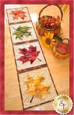 a table runner with autumn leaves on it