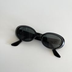 These round oval sunglasses are your everyday classic frames.  Featuring a brown tortoise frame with black lens.  This style is unisex.  True genuine vintage sunglasses from the 90s.   - 400 uv  - new vintage from the 90s Measurements:  Lens Height: 32mm  Lens Width: 50mm  Bridge:  17mm  Arm temple: 140mm Frame width: 133mm Also available in brown tortoise  Frame material: polyurethane  Lens material: glass Includes sunglasses pouch 90 Sunglasses, Black Oval Sunglasses, Sunglasses Pouch, Style Upgrade, Girls With Glasses, Oval Sunglasses, Vintage Sunglasses, Perfect Wardrobe, Classic Frame