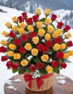 a basket filled with lots of colorful roses on top of a wooden table in the snow