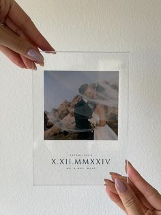 two hands holding up a framed photo with the words xxiimix on it