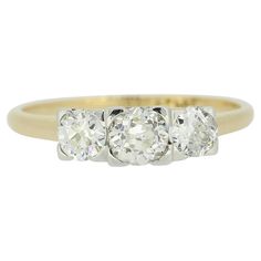 three stone diamond ring in yellow gold