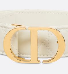 Inspired by the hallmark namesake bag, the 30 Montaigne belt is offered in a new variation that's timeless and elegant, showcasing House codes. Crafted in latte smooth calfskin, it stands out with the originality and quilted effect of its iconic Cannage stitching, attesting to the House's unique savoir-faire. Embellished with an iconic CD buckle in shiny gold-finish metal, the belt pairs well with jeans, a skirt or dress.. 75 Christian Dior Paris, Dior Star, Icon Shoes, Luxury Belts, Dior Book Tote, Christian Dior Couture, Dior Couture, Star Shoes, Wallet Pouch