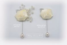 two white roses and pearls are attached to the side of each ear pins with beads on them