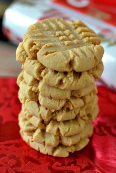 a stack of cookies sitting on top of a red cloth