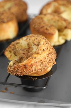 two muffins sitting on top of a black tray