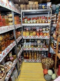 a store filled with lots of different types of jars and food in it's shelves