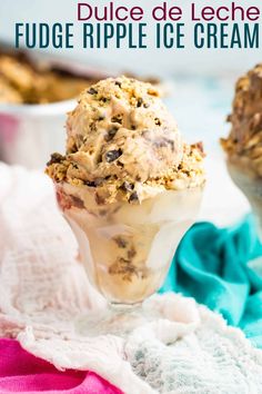 an ice cream sundae in a glass on top of a table with other desserts