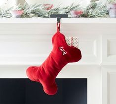 a christmas stocking hanging from a mantel