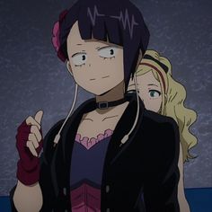 an anime character with headphones in her ears and two other characters behind her looking at the camera