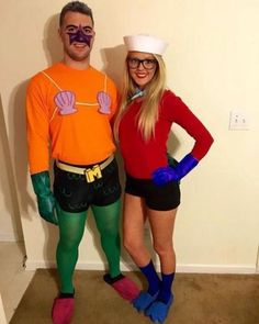 a man and woman in costumes standing next to each other, one wearing an orange shirt and the other green leggings