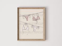 an art piece hanging on a clothes line with bras and panties hung to dry