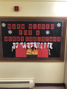 a christmas bulletin board hanging on the wall