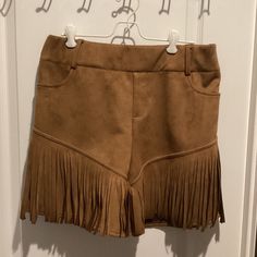 Calling All Cowgirls Out There! Have I Got A Great Nwt Pair Of Women’s “Crazy Train” Brown Fringe Shorts - Size 3x. These Shorts Would Be The Perfect Western Wear For Concerts, Festivals, Etc. They Are Pull-On Elastic Waist And Feature Two Front Pockets And Belt Loops. They Are Machine Washable And Are 100% Polyester. In My Opinion, They **Run Small**! If This Is Your Size, Don’t Miss Out On This Great Pair Of Western Shorts! Western Shorts, Fringe Shorts, Brown Fringe, Crazy Train, Short Fringe, Western Wear, Elastic Waist, Train, Festival