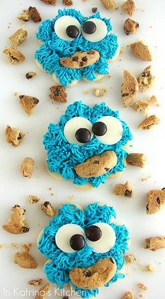 cookie cookies with blue frosting and googly eyes on them, all decorated to look like cookie monster