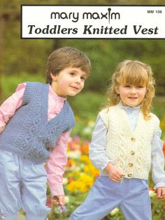 two young children wearing sweaters and vests in knitting pattern, standing next to each other