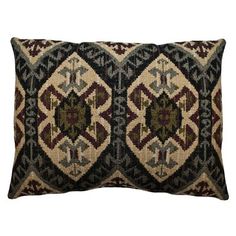 a black and brown pillow with an intricate design on the front, sitting on a white background