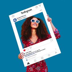 a woman wearing sunglasses holding up a tweet with the word instagram on it