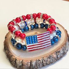 A Beautiful, Elegant Bracelet For Independence Day. It Includes A Lovely Flag Connector Attached To 3 Strands Of Bracelets. Colored Glass Pearl Beads, An Enamel Flag Metal Connector, And Rhinestone Roundel Spacers. This Is A Perfect Gift For Mom And Made To Fit Teens Through Adults. Measures Approximately 7-7.5 Inches. Blue Adjustable Stretch Bracelet For 4th Of July, Blue Adjustable Bracelets For 4th Of July, Adjustable Blue Jewelry For 4th Of July, Patriotic Blue Beaded Stretch Bracelet, Blue Beaded Patriotic Stretch Bracelet, Blue Stretch Bracelet For 4th Of July Gift, Multicolor Beaded Bracelets For 4th Of July, Adjustable Patriotic Jewelry With Colorful Beads, Patriotic Adjustable Colorful Beads Jewelry