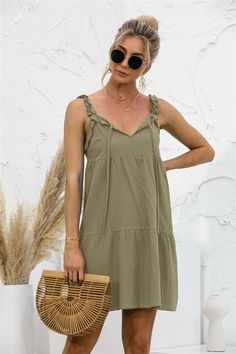 This summer tunic dress is perfect to dress up or down depending on your day. Easily pair this dress with your favorite leather sandals and summer accessories. MEASUREMENTS: Small - Chest & Waist: 35"-37"inMedium - Chest & Waist: 37"-39"inLarge - Chest & Waist: 39"-41"inXL- Chest & Waist: 41"-43"in Spring Sundress With Tie Straps For Day Out, Shift Sundress For Vacation, Casual Midi Dress For Spring Outing, Casual Sundress For Summer, Casual Sundress For Summer Outing, Shift Knee-length Summer Mini Dress, Summer Knee-length Shift Mini Dress, Shift Mini Dress For Beach In Summer, Casual Spring Dresses With Tie Straps